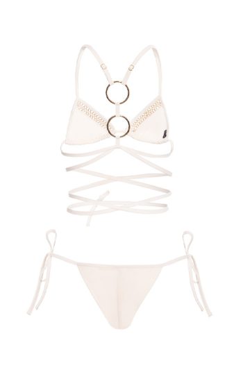 Rhea Bikini 34 RHEA black bikini with gold accents and adjustable ties sensual pose with arms raised against ocean backdrop gost white retro